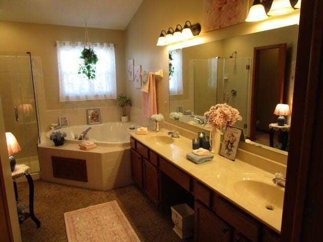 5669 Maplewood Ct, Lewis Center, OH 43035 - bathroom featuring a shower stall, lofted ceiling, double vanity, and a garden tub