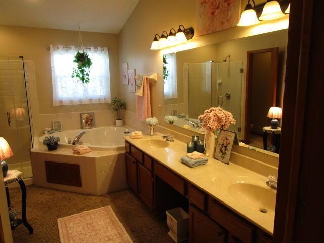 5669 Maplewood Ct, Lewis Center, OH 43035 - full bathroom with a stall shower, a garden tub, double vanity, and vaulted ceiling