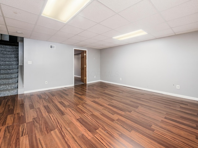 419 Sycamore Creek St, Pickerington, OH 43147 - spare room with stairs, a paneled ceiling, and dark wood-style floors