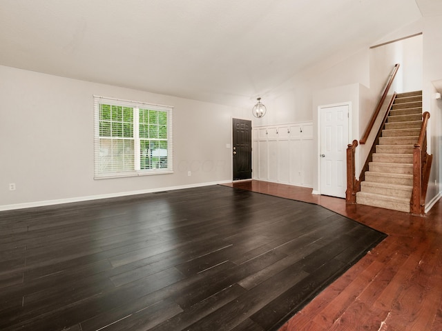419 Sycamore Creek St, Pickerington, OH 43147 - unfurnished living room with stairs, dark wood-type flooring, and vaulted ceiling