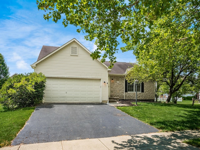 419 Sycamore Creek St, Pickerington, OH 43147 - view of front of home featuring asphalt driveway, a garage, a front lawn, stone siding, and a shingled roof
