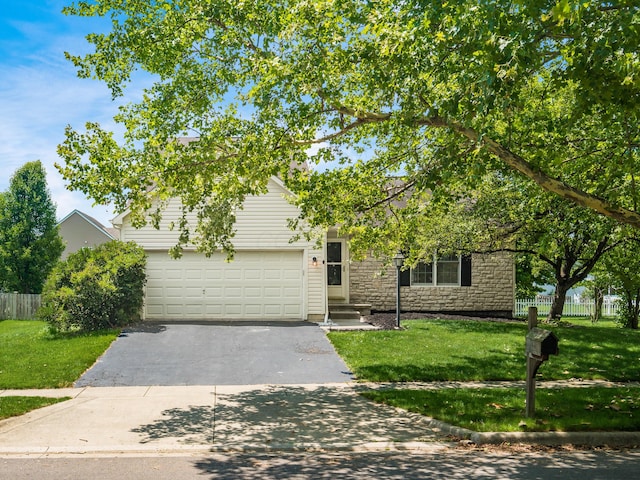 419 Sycamore Creek St, Pickerington, OH 43147 - view of property hidden behind natural elements with asphalt driveway and stone siding