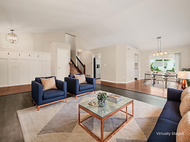 419 Sycamore Creek St, Pickerington, OH 43147 - living area featuring wood finished floors, lofted ceiling, stairs, and a chandelier