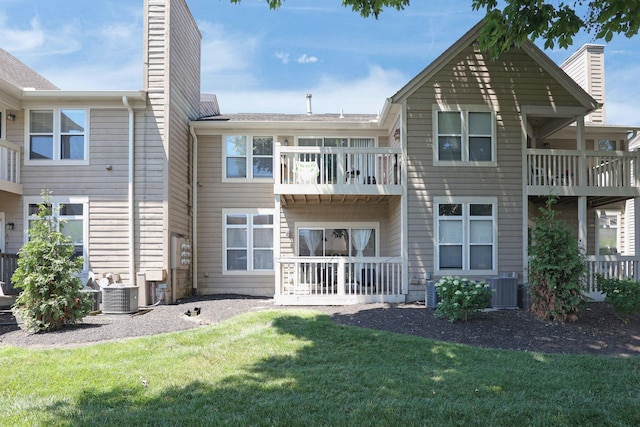 3388 Smileys Cor, Hilliard, OH 43026 - back of house featuring a balcony, a chimney, and a yard