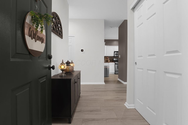 3388 Smileys Cor, Hilliard, OH 43026 - hallway featuring baseboards and light wood finished floors