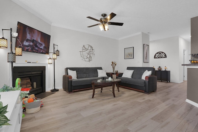 3388 Smileys Cor, Hilliard, OH 43026 - living room featuring light wood-style floors, crown molding, a fireplace, and ceiling fan