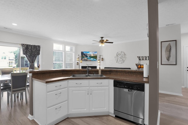 3388 Smileys Cor, Hilliard, OH 43026 - kitchen with stainless steel dishwasher, a textured ceiling, crown molding, dark countertops, and healthy amount of natural light