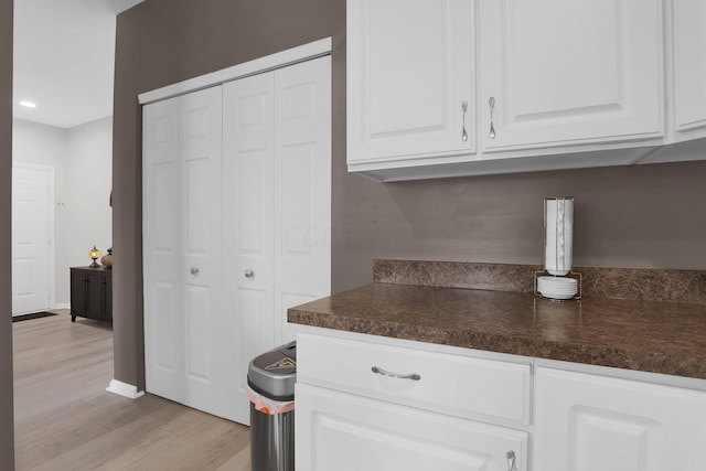 3388 Smileys Cor, Hilliard, OH 43026 - kitchen featuring light wood-style flooring, dark countertops, white cabinets, and recessed lighting