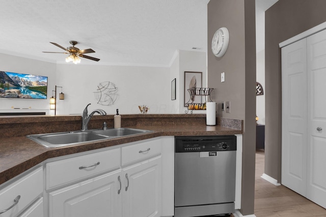 3388 Smileys Cor, Hilliard, OH 43026 - kitchen with stainless steel dishwasher, ceiling fan, dark countertops, crown molding, and white cabinets
