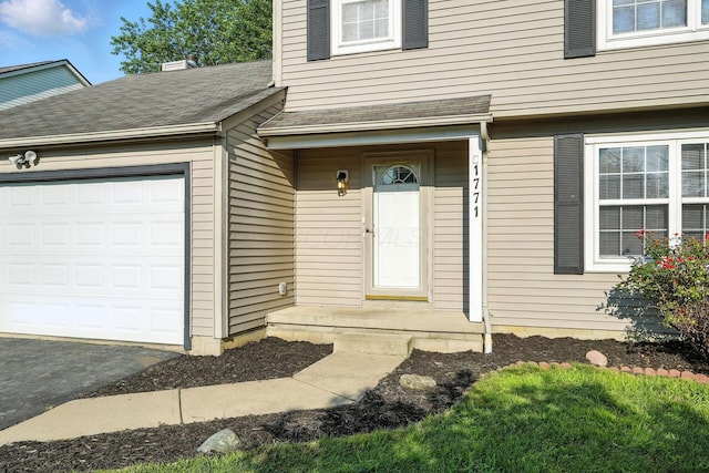 1771 Fern Trail Dr, Lancaster, OH 43130 - entrance to property featuring an attached garage and asphalt driveway