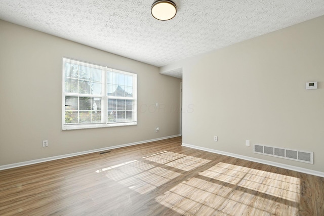 1771 Fern Trail Dr, Lancaster, OH 43130 - empty room featuring wood finished floors and a textured ceiling