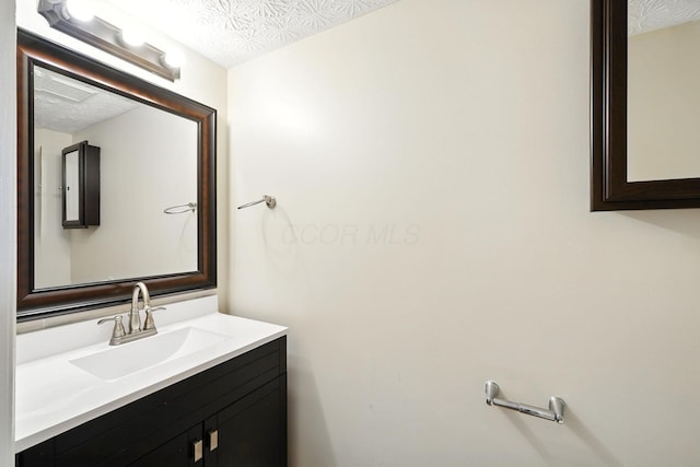 1771 Fern Trail Dr, Lancaster, OH 43130 - bathroom featuring a textured ceiling and vanity