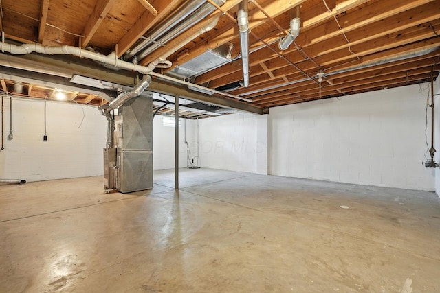 1771 Fern Trail Dr, Lancaster, OH 43130 - unfinished below grade area featuring heating unit and concrete block wall