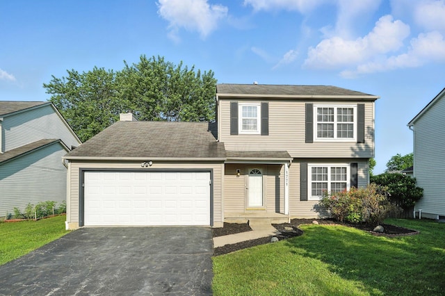 1771 Fern Trail Dr, Lancaster, OH 43130 - view of front of home featuring asphalt driveway, a garage, a front yard, and a chimney