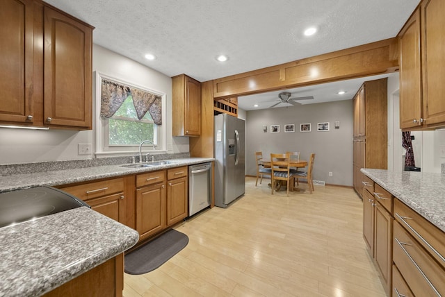 1539 Clubview Blvd S, Columbus, OH 43235 - kitchen featuring stainless steel appliances, a ceiling fan, brown cabinets, recessed lighting, and light wood-type flooring