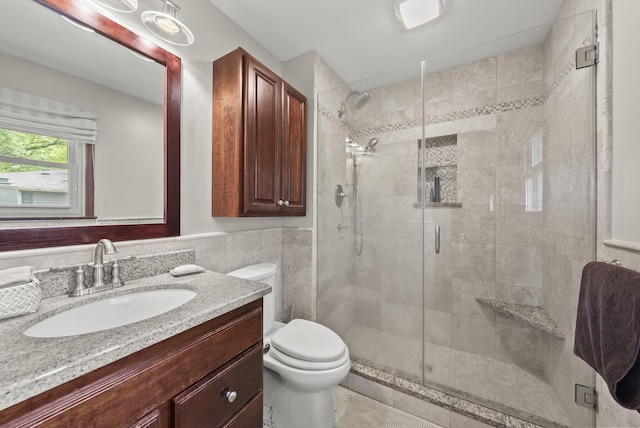 1539 Clubview Blvd S, Columbus, OH 43235 - bathroom featuring vanity, a stall shower, tile walls, and a wainscoted wall