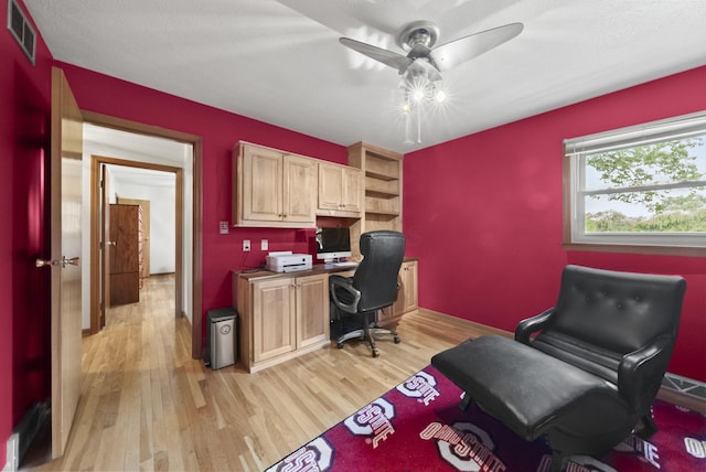 1539 Clubview Blvd S, Columbus, OH 43235 - home office featuring light wood finished floors, ceiling fan, and built in desk