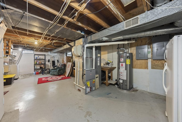 1539 Clubview Blvd S, Columbus, OH 43235 - unfinished below grade area with gas water heater, freestanding refrigerator, electric panel, and heating unit