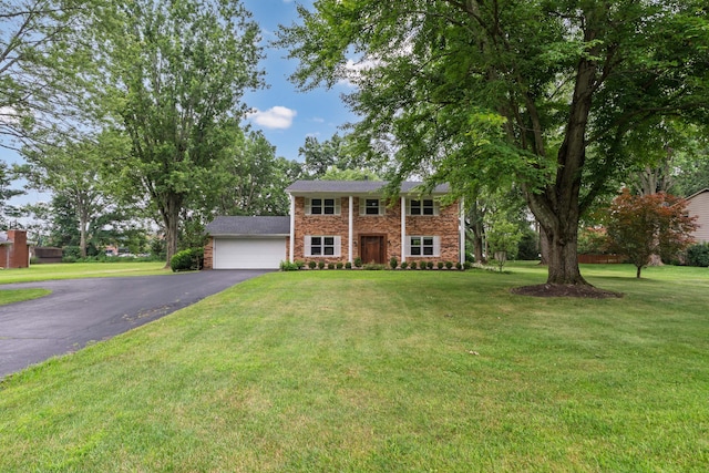 6853 Cedar Brook Pl, New Albany, OH 43054 - colonial-style house with asphalt driveway, a front lawn, and brick siding