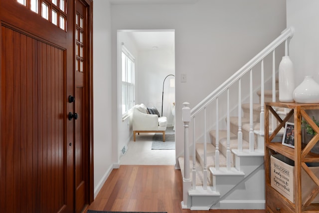 6853 Cedar Brook Pl, New Albany, OH 43054 - foyer with wood finished floors and stairway