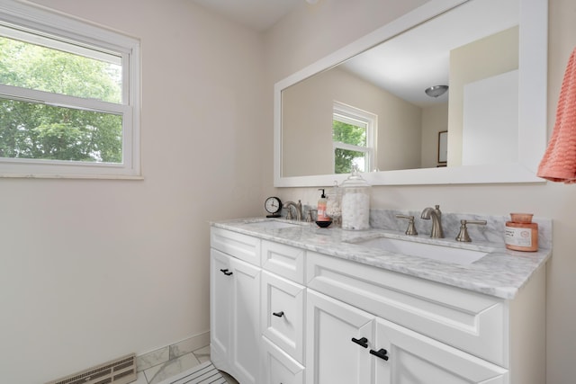 6853 Cedar Brook Pl, New Albany, OH 43054 - bathroom featuring double vanity and marble look tile flooring