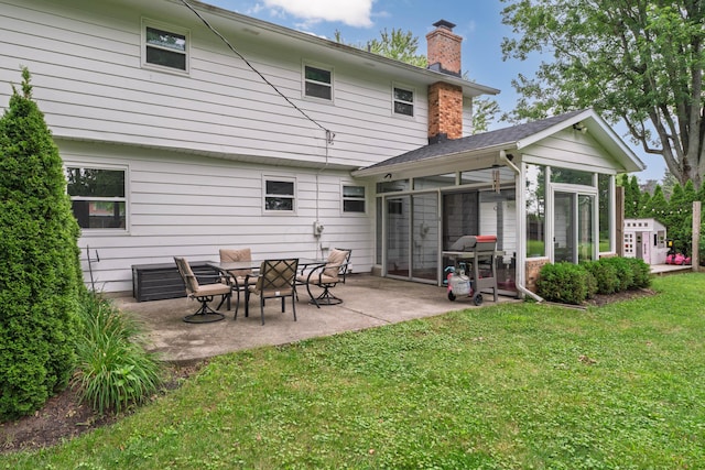 6853 Cedar Brook Pl, New Albany, OH 43054 - rear view of property featuring a sunroom, a chimney, a yard, and a patio