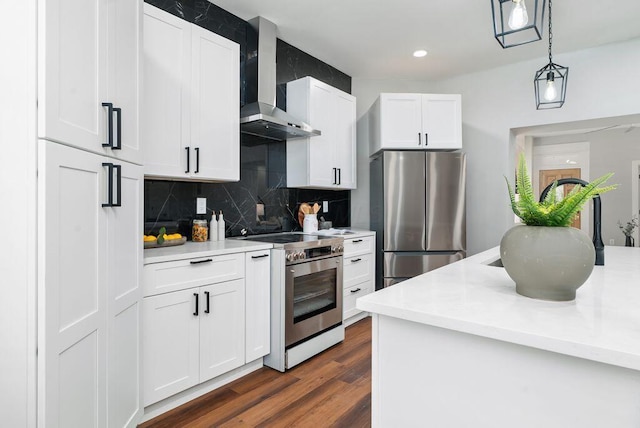 994 Harrison Ave, Columbus, OH 43201 - kitchen with appliances with stainless steel finishes, wall chimney exhaust hood, light countertops, pendant lighting, and recessed lighting