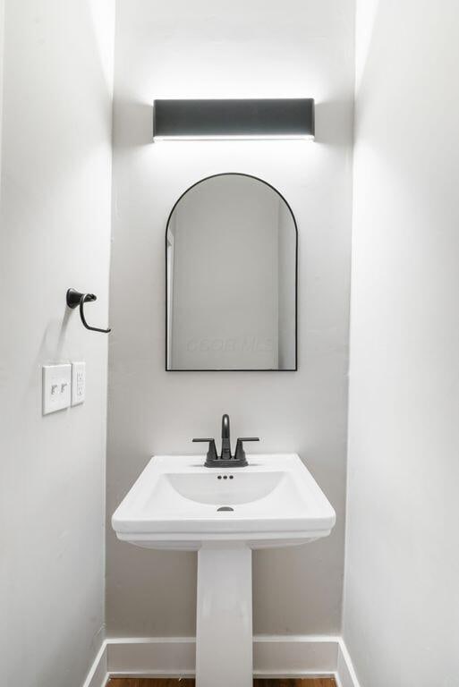 994 Harrison Ave, Columbus, OH 43201 - bathroom featuring baseboards and wood finished floors