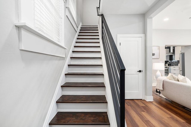 994 Harrison Ave, Columbus, OH 43201 - staircase with wood finished floors and recessed lighting