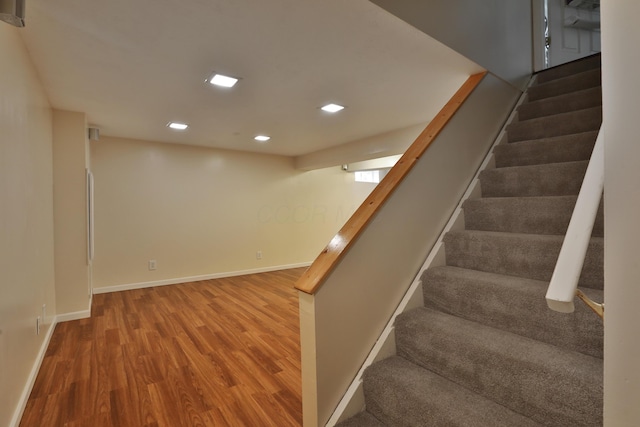 2253 Otter Ln, Dublin, OH 43016 - stairs with wood finished floors and recessed lighting