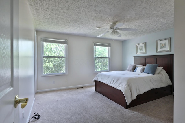 2253 Otter Ln, Dublin, OH 43016 - carpeted bedroom featuring ceiling fan and a textured ceiling