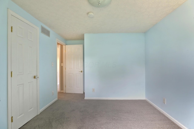 2253 Otter Ln, Dublin, OH 43016 - unfurnished bedroom featuring a textured ceiling and carpet