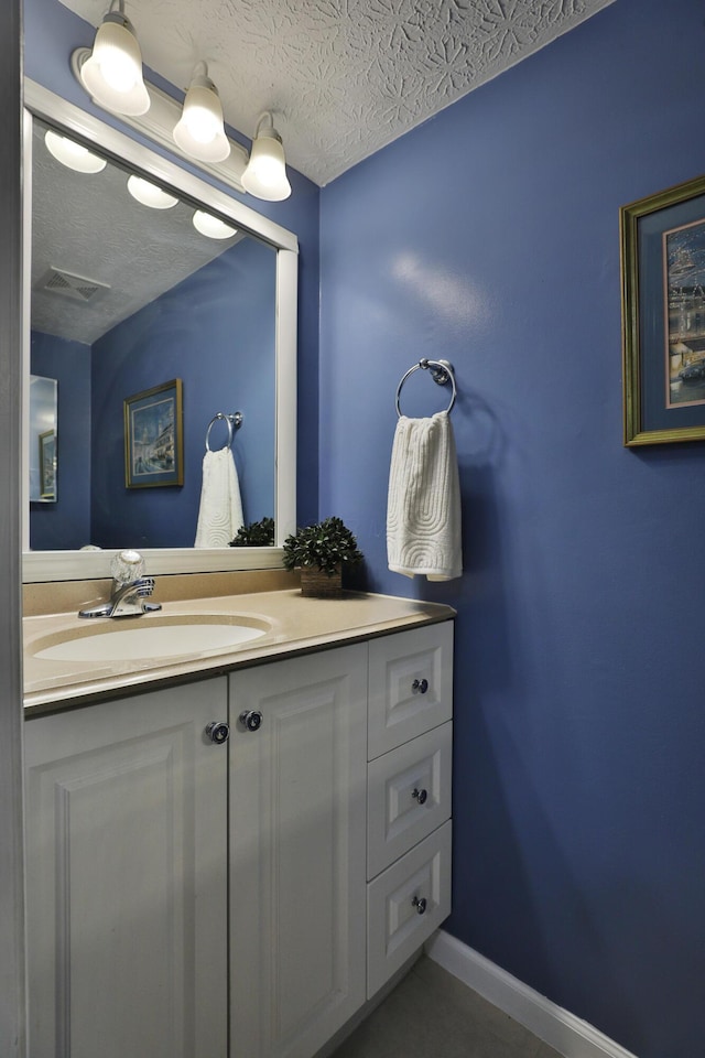 2253 Otter Ln, Dublin, OH 43016 - bathroom with vanity and a textured ceiling