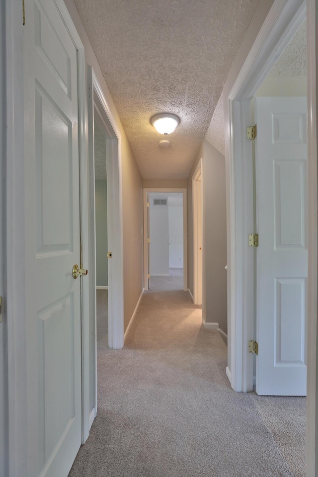 2253 Otter Ln, Dublin, OH 43016 - hallway featuring carpet flooring and a textured ceiling