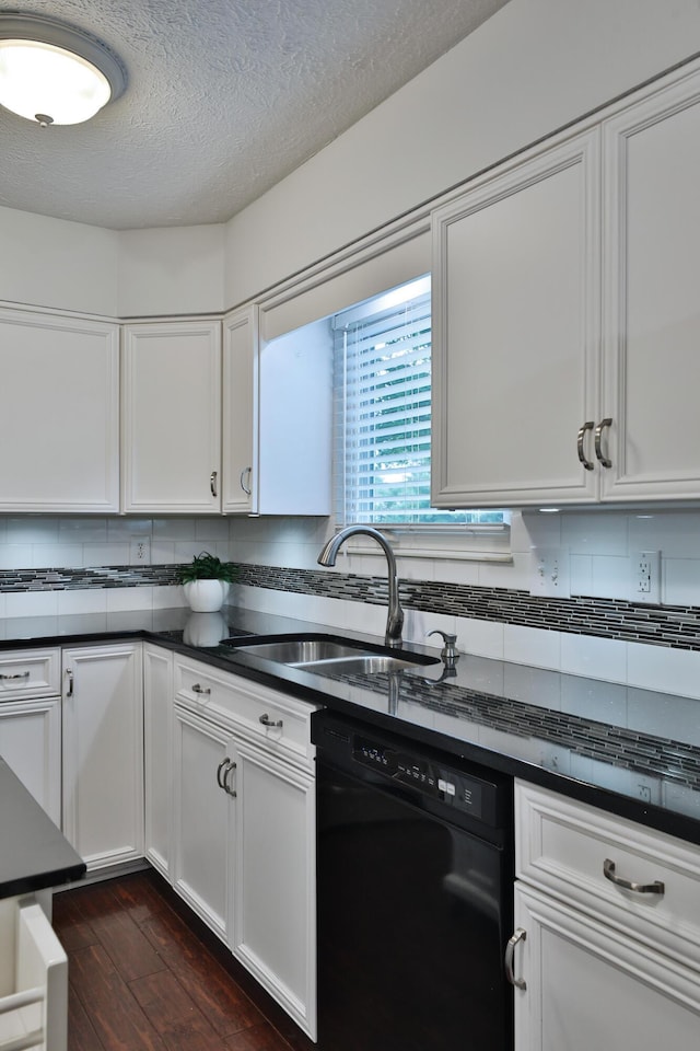 2253 Otter Ln, Dublin, OH 43016 - kitchen with dishwasher, dark countertops, white cabinets, dark wood-style floors, and a textured ceiling