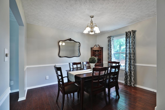 2253 Otter Ln, Dublin, OH 43016 - dining space featuring a chandelier, hardwood / wood-style flooring, and a textured ceiling