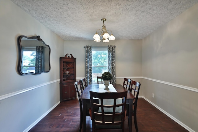 2253 Otter Ln, Dublin, OH 43016 - dining space featuring a chandelier, dark wood-style flooring, and a textured ceiling