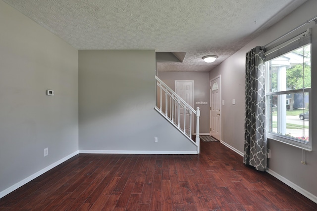 2253 Otter Ln, Dublin, OH 43016 - entryway with a textured ceiling, stairway, and wood finished floors