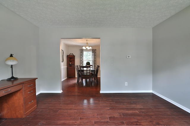 2253 Otter Ln, Dublin, OH 43016 - spare room with dark wood-style floors, a chandelier, and a textured ceiling