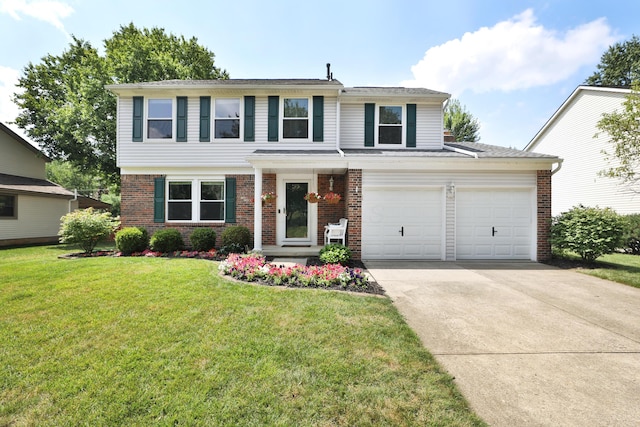 2253 Otter Ln, Dublin, OH 43016 - view of front of property featuring brick siding, concrete driveway, and a front yard
