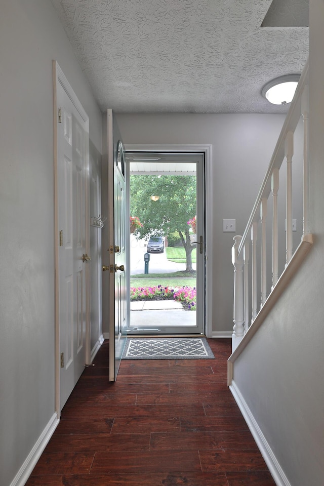 2253 Otter Ln, Dublin, OH 43016 - entryway featuring wood finished floors, stairway, and a textured ceiling