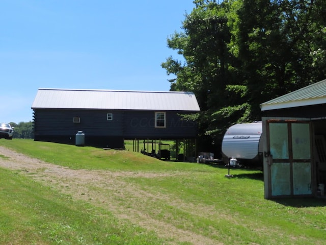 485 Springer Rd, Chillicothe, OH 45601 - back of property featuring a lawn and a metal roof