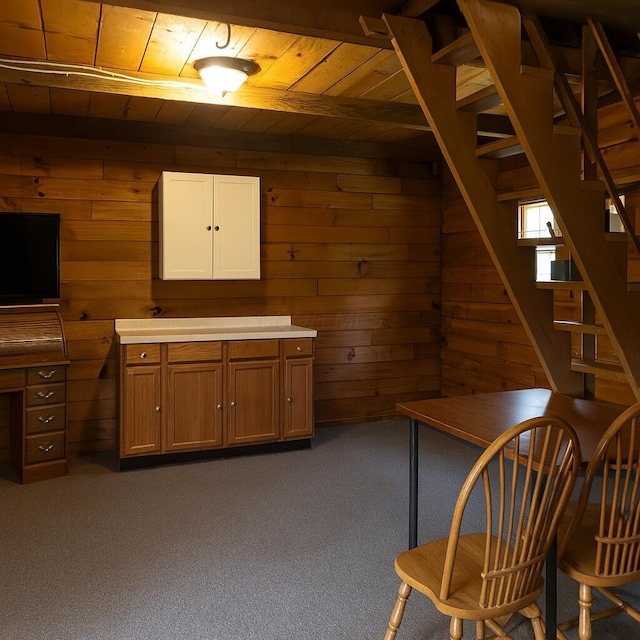 485 Springer Rd, Chillicothe, OH 45601 - basement with wooden ceiling, wooden walls, dark carpet, and stairs