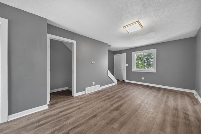 3654 Arnelle Rd, Columbus, OH 43228 - spare room featuring wood finished floors and a textured ceiling