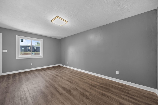 3654 Arnelle Rd, Columbus, OH 43228 - spare room featuring dark wood finished floors and a textured ceiling
