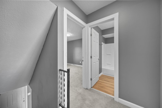 3654 Arnelle Rd, Columbus, OH 43228 - hall featuring carpet flooring, an upstairs landing, and a textured ceiling