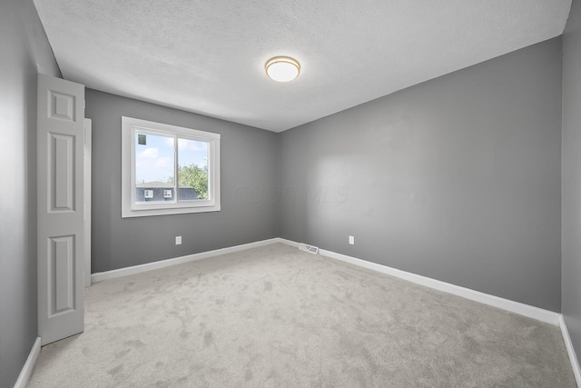 3654 Arnelle Rd, Columbus, OH 43228 - unfurnished room with carpet floors and a textured ceiling