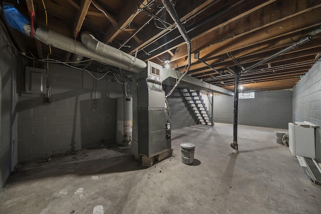 3654 Arnelle Rd, Columbus, OH 43228 - unfinished below grade area with gas water heater, electric panel, stairway, and heating unit