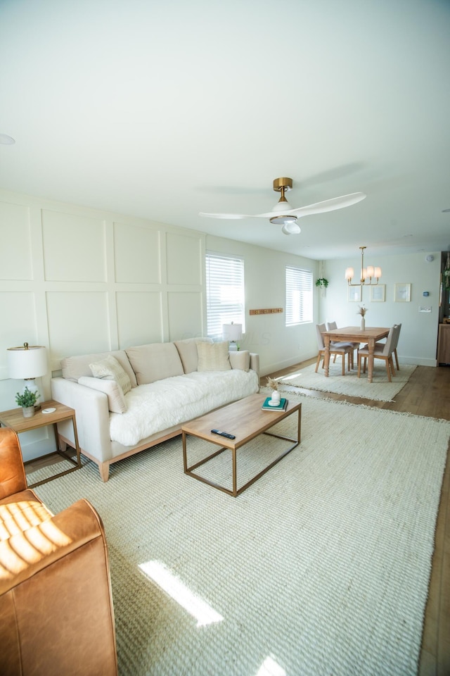 853 Thurman Ave, Columbus, OH 43206 - living room with a decorative wall, ceiling fan, and wood finished floors