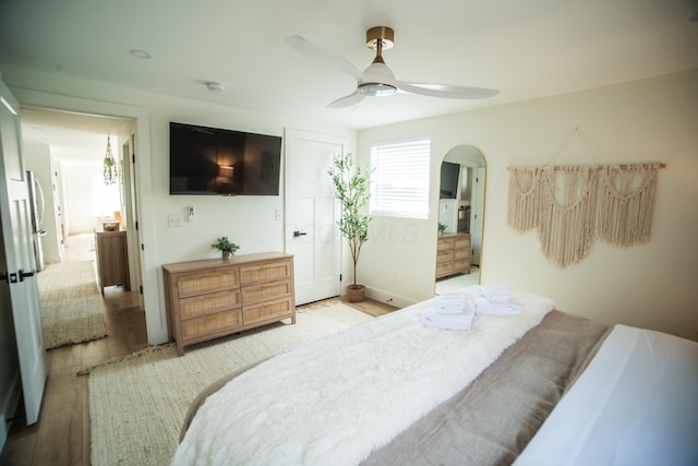853 Thurman Ave, Columbus, OH 43206 - bedroom featuring light wood-style floors, a ceiling fan, and arched walkways